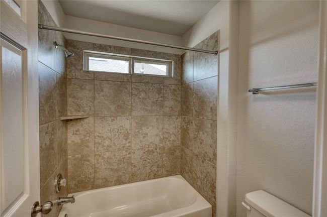 Full bathroom with toilet and shower / bathing tub combination | Image 29
