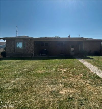 Rear view of property featuring a fenced in yard | Image 2