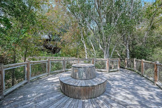 Features a single-family home with a spacious yard in Bridgeland, a master-planned community offering lakes, pools, sidewalks, and green spaces. | Image 33