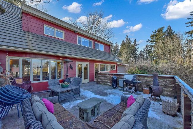 View of patio with an outdoor hangout area, french doors, and grilling area | Image 40