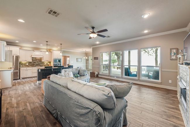 The open concept layout of the house means gorgeous lake views from the moment you enter. | Image 7