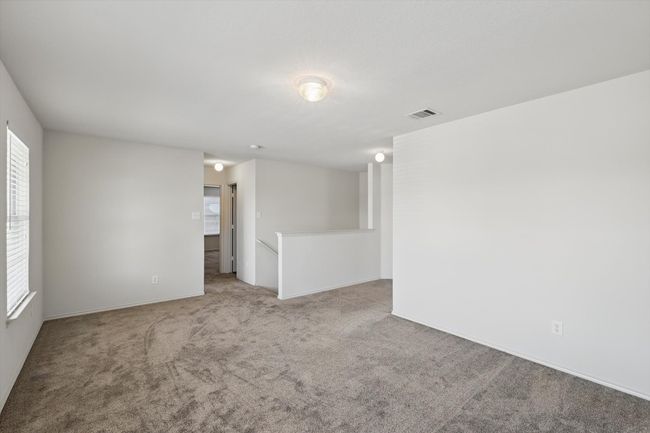 Unfurnished room featuring light colored carpet and baseboards | Image 19