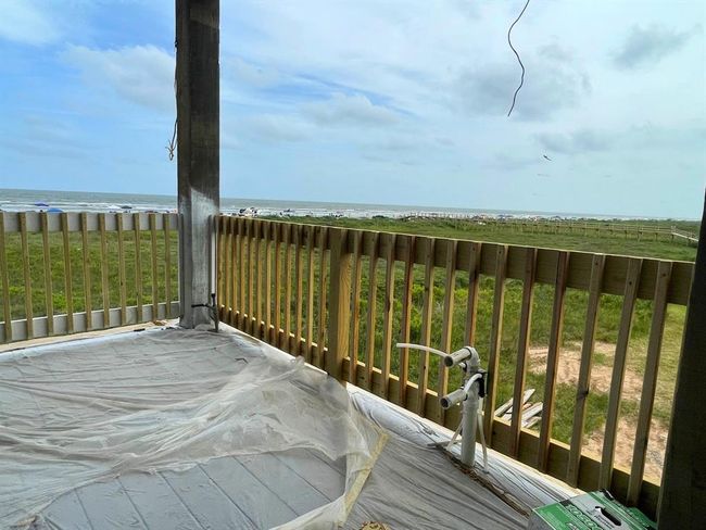 This corner of the patio is pre-plumbed and perfectly positioned for your outdoor kitchen — fire up the grill with the waves as your backdrop and beachgoers just steps away. | Image 34