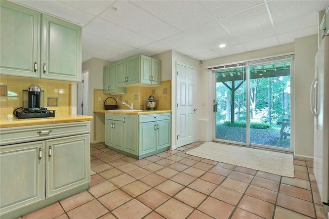 Lower level summer kitchen with sliders to rear yard | Image 25