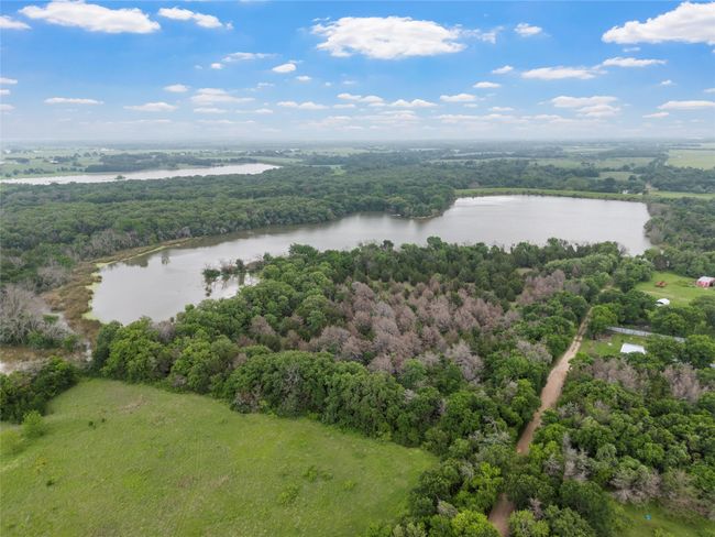 Birds eye view of property featuring a water view and a view of trees | Image 8