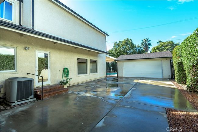 Garage. Secured carport as well behind photo. Tons of parking. | Image 50