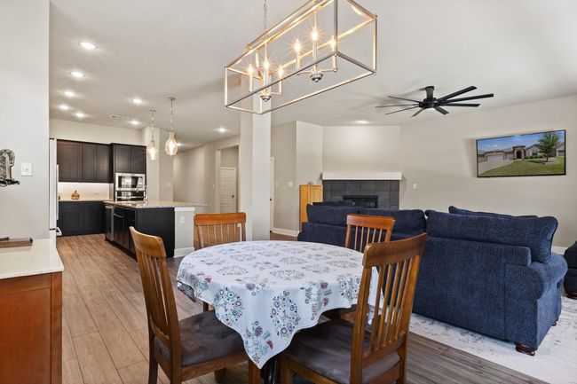 Dining area connected and open to the kitchen and family room | Image 19