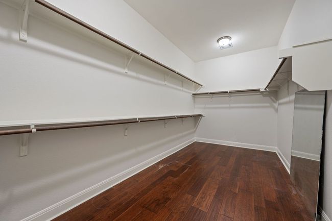 Spacious closet featuring wood finished floors | Image 23