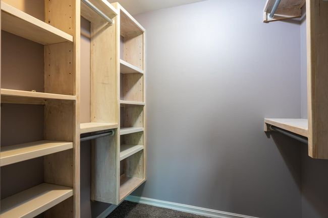 Walk in closet with carpet | Image 31