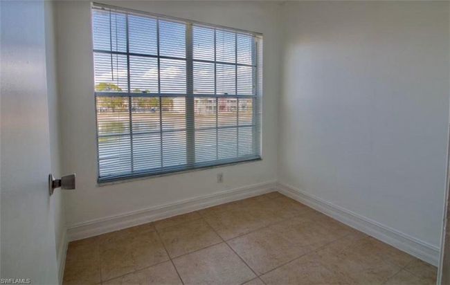Spare room with baseboards and light tile patterned floors | Image 7