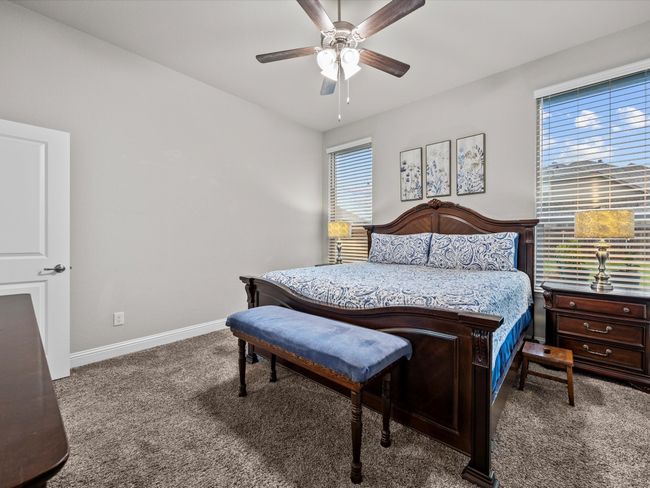 Carpeted bedroom with baseboards and ceiling fan | Image 15