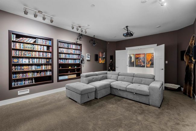 Home theater room with carpet flooring and baseboards | Image 29