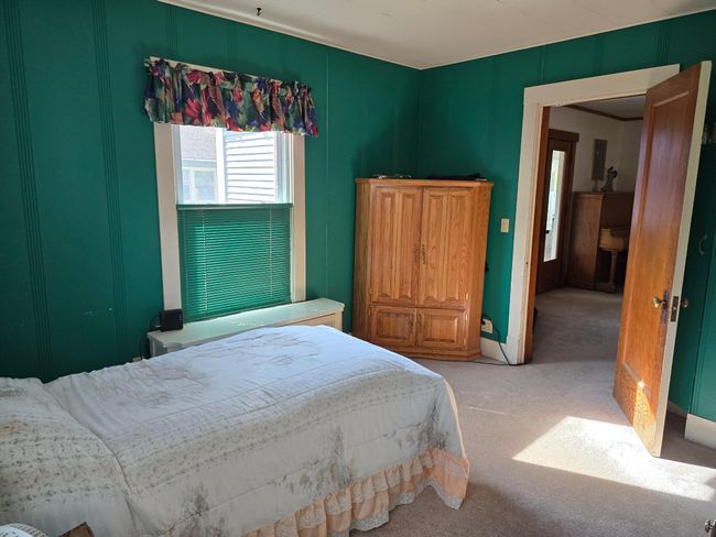 Main floor bedroom located off of living room-perfect for guests | Image 14