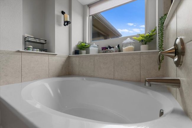 Full bath featuring a bath | Image 31
