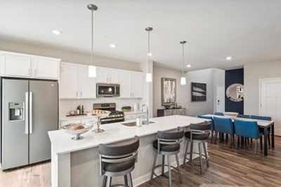 (Photo of decorated model, actual home's finishes will vary) Welcome to the St. Clair! Thoughtfully-designed with a combination of functionality and modern design, this kitchen space is sure to impress. | Image 1