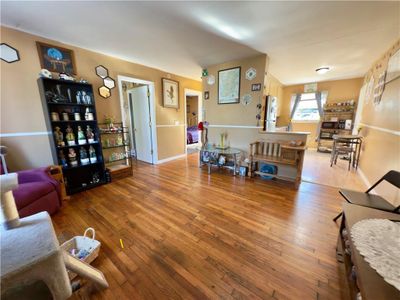 Living room with hardwood / wood-style flooring | Image 3