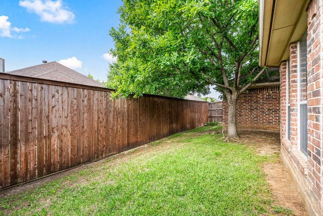 View of yard with a fenced backyard | Image 27