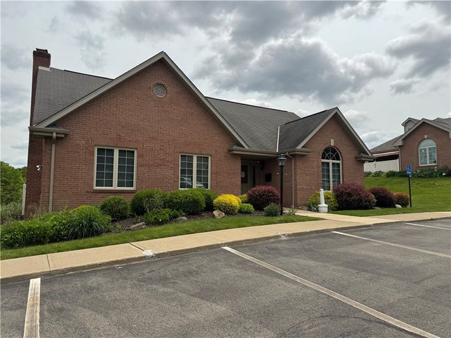 This is the community building available for rent for parties and gatherings. Just behind the building is your swimming pool, perfect for summer fun! | Image 21