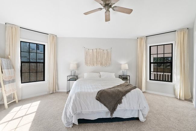 Bedroom with multiple windows, carpet floors, and baseboards | Image 18