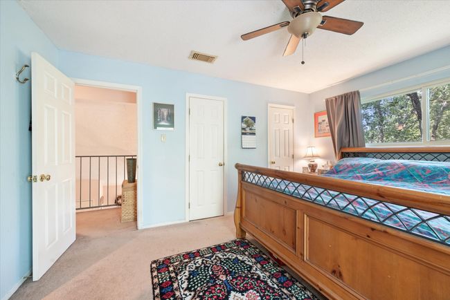 Carpeted bedroom featuring ceiling fan | Image 22