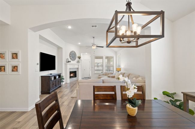 Sophisticated lighting elevates the dining space with a warm, inviting glow and timeless style. | Image 15