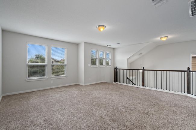 Carpeted spare room featuring baseboards | Image 25