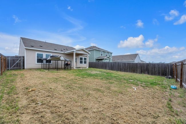 Perfect for entertaining, the backyard provides a private and spacious area for gatherings. | Image 25