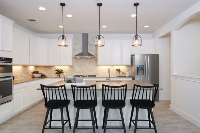 Photo of Pulte model home with same floor plan, not of actual home listed. | Image 10