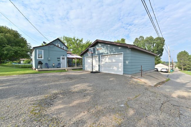 REAR EXTERIOR WITH GARAGE ALLEY VIEW | Image 25
