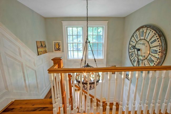 Stairs featuring a chandelier and a decorative wall | Image 16