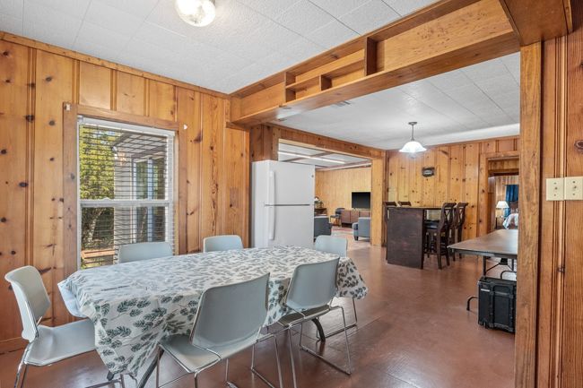 Dining room with wooden walls | Image 13
