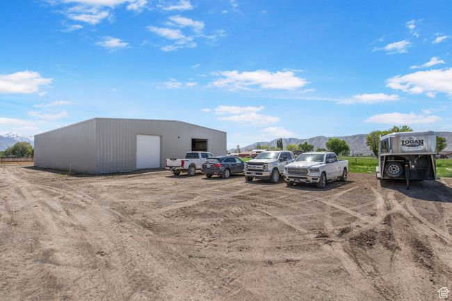 View of car parking with a mountain view and a garage | Image 29