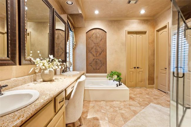 Primary bath with double sinks, custom paint, jetted tub. | Image 17