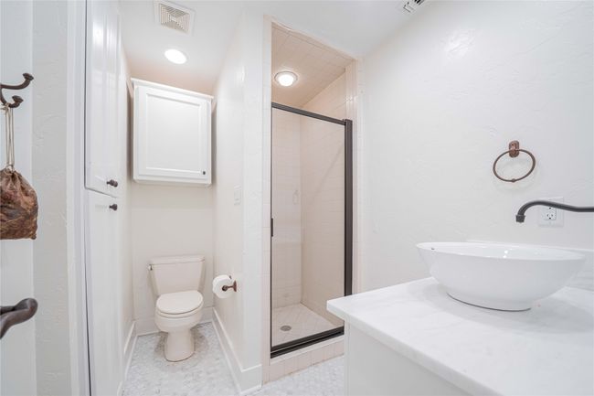 Full bathroom featuring a shower stall and vanity | Image 27