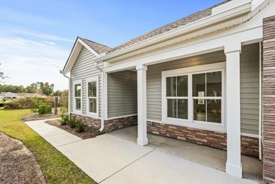 View of exterior entry featuring a patio area | Image 2