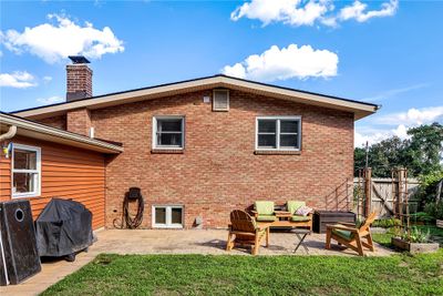 The patio space is a great spot for grilling and entertaining. Raised garden beds for your favorite plants and vegetables. | Image 3