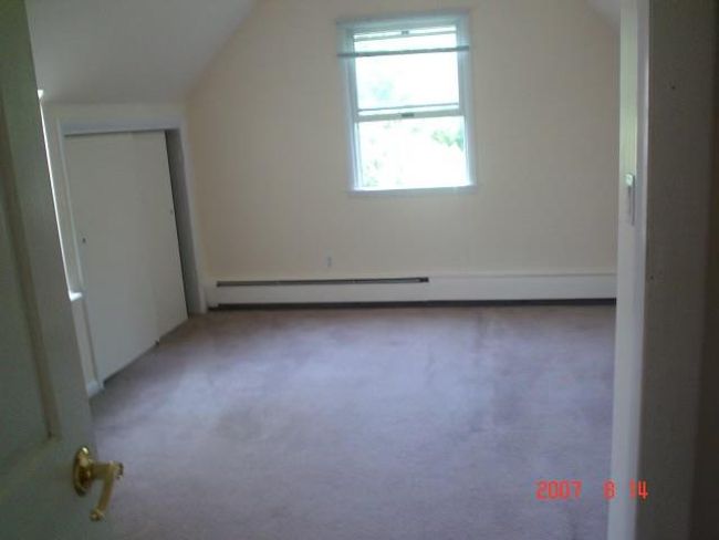 2nd Fl Bedroom with carpet, vaulted ceiling, and a baseboard heating unit | Image 13