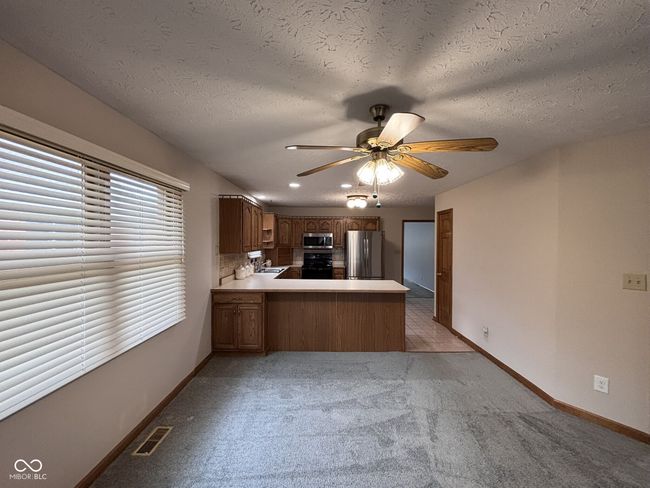 Dining Rm Kitchen view features Breakfast Bar | Image 6