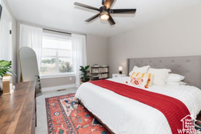 Carpeted bedroom featuring baseboards and a ceiling fan | Image 10