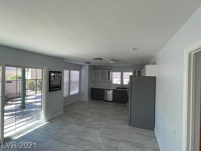 Kitchen with baseboards, visible vents, and stainless steel appliances | Image 6
