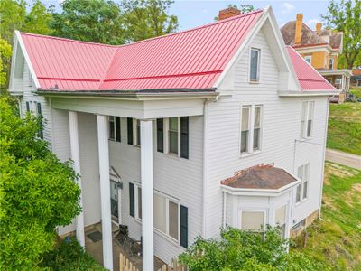 Beautiful covered from porch and new metal roof | Image 1