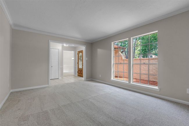 A view of the entry from the living room across to the formal dining room. | Image 9