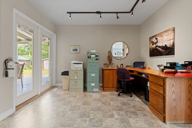 Office space featuring plenty of natural light and track lighting | Image 29