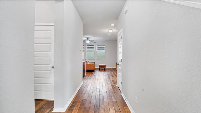 Hall with baseboards and hardwood / wood-style floors | Image 15
