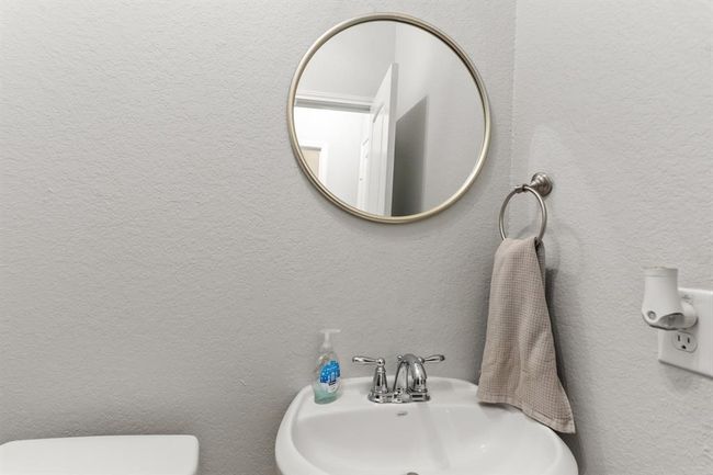 This well-appointed half bathroom is great for when you have family, friends, and guests over. | Image 4