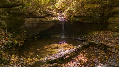 Waterfall located on the property with a small pool to cool off in. | Image 1