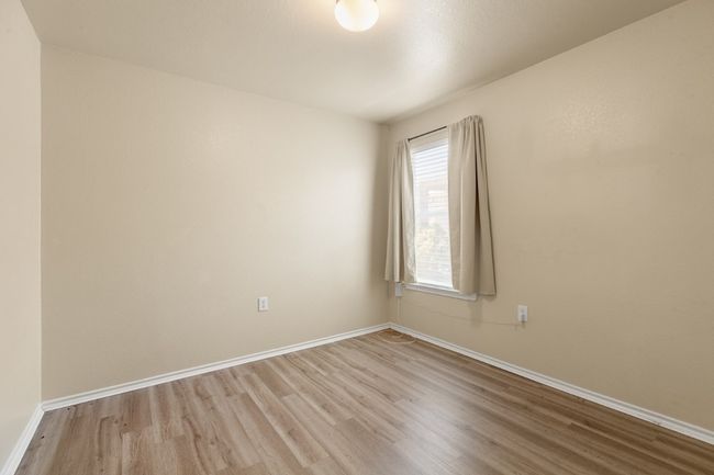 Unfurnished room with wood finished floors and baseboards | Image 22