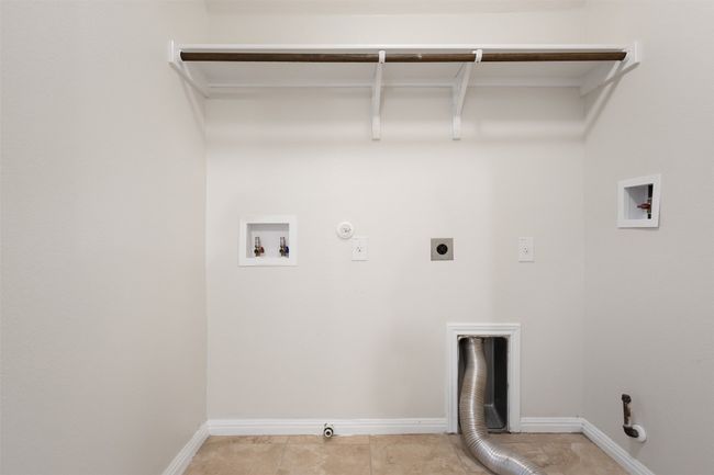 Laundry room with gas dryer hookup, electric dryer hookup, washer hookup, and light tile patterned floors | Image 29