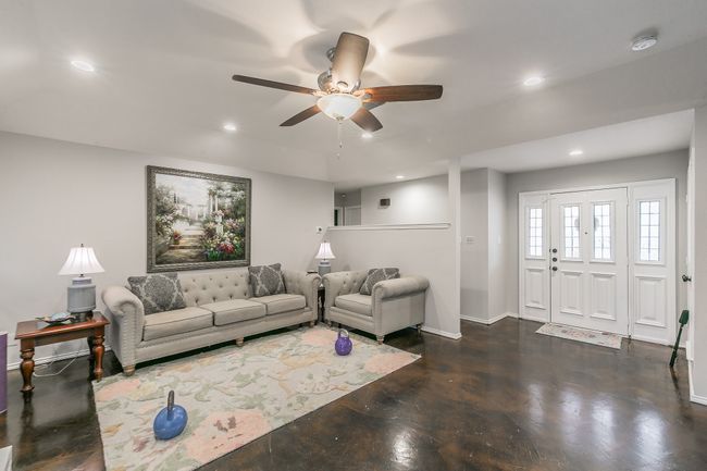 Unit 4904 Living room with ceiling fan | Image 24