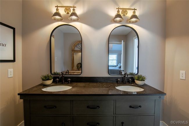 Full bathroom with double vanity and a sink | Image 32